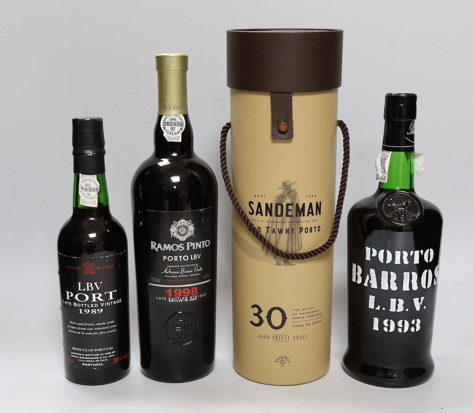 Four bottles of port: Sandeman, Barros, LBV and Ramos Pinto